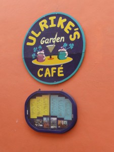 Round blue sign of Ulrikes Cafe in Pisac Market, Peru