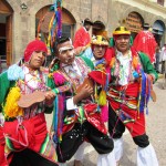Men dancing in traditional costume in Cusco, Peru
