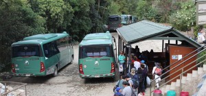 2 Green Shuttle Buses waiting to depart from Machu Picchu