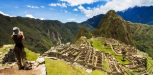 traveler taking a picture of Machu Picchu