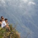 Travelers overlooking Urubamba Valley from a cliff
