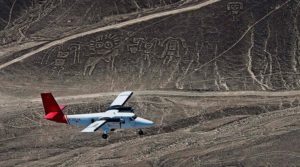 aearial view of nazca lines on a desert hill