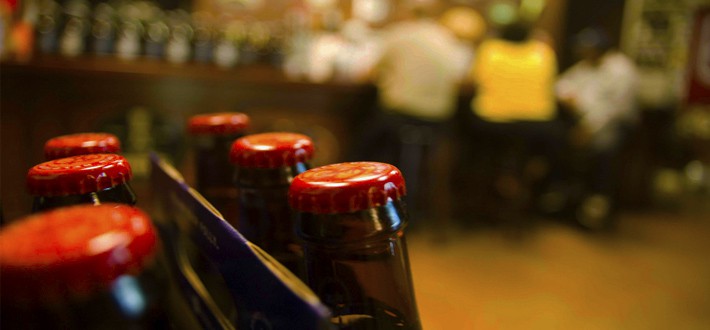 Bottle Tops of Peruvian Beer Bottles in a Bar